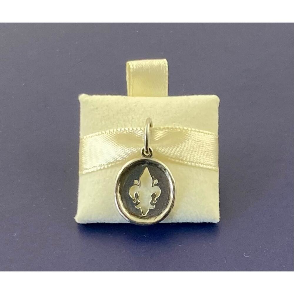 Waxing poetic Fleur De Lis sterling silver charm